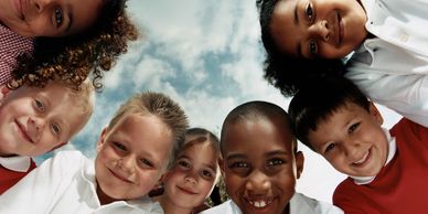 Group-of-children-smiling-down-at-camera