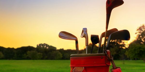 golf clubs golf bag sunset