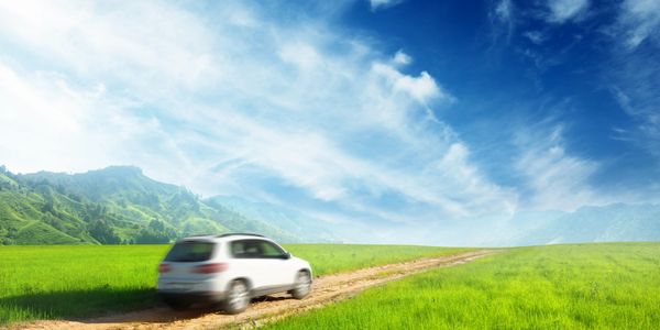 A car driving across a field