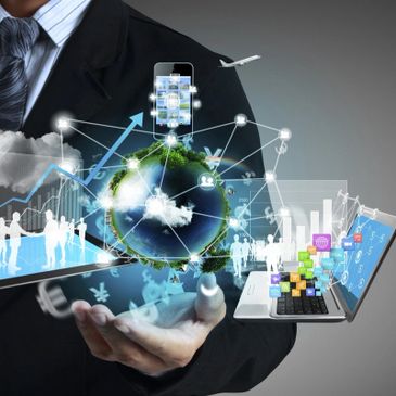 Businessman holding digital globe with technology and communication icons.
