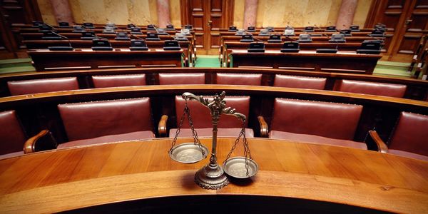 Scales of Justice in a Courtroom