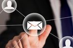Person interacting with email icon on a digital interface.
