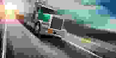 A speeding big rig truck on a road.