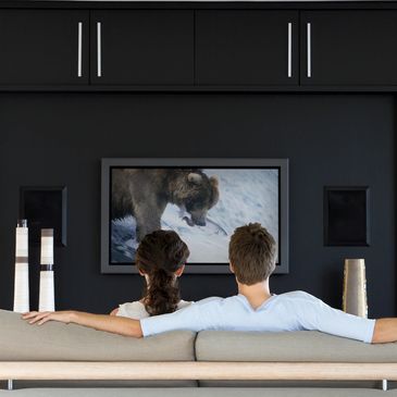 TV wall Mount with Home theater surround sound and full Audio Video install  in living area.