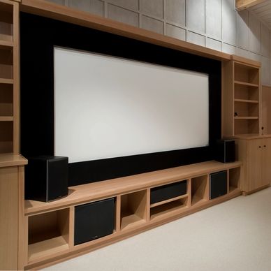 Custom home theater installation with surround sound speakers in a Houston residence.
