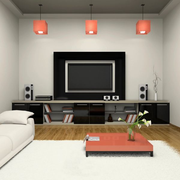 Modern living room with a low orange coffee table and black entertainment unit.