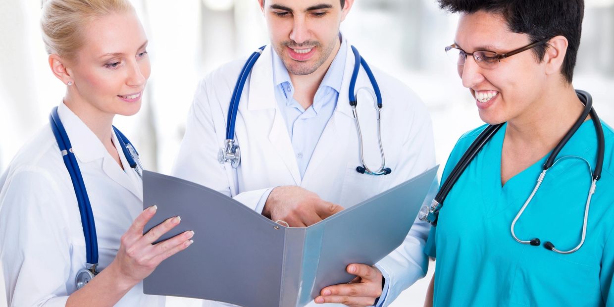 Podiatrists reviewing a chart at a fast growing podiatry practice.