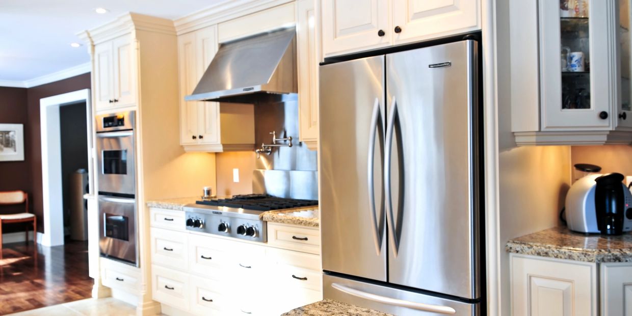 Modern kitchen with granite countertops and stainless steel appliances.