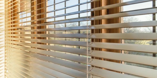 Picture of Hunter Douglas blinds installed in a living room.