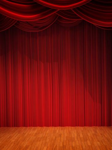 Closed red theater curtain on wooden stage floor.