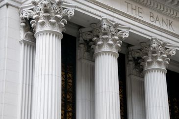 Classical bank building with ornate Corinthian columns.
