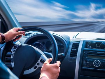 Instructor teaching student how to drive