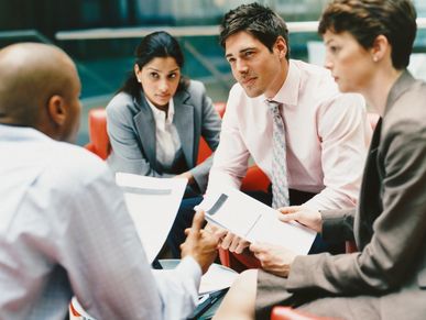 Group of people together in a meeting