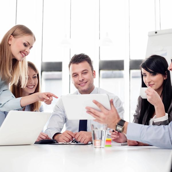 4 professionals walking down the stairs