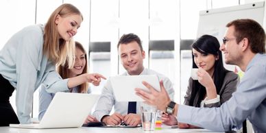 A team of people around a conference table