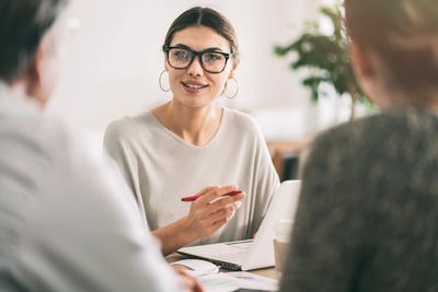 Insurance desk claims handler reviewing. 