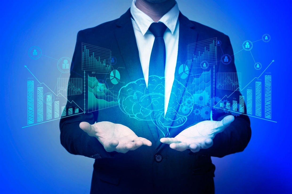 Mind being hacked or manipulated on a computer screen. Man in suit with hands out under brain image