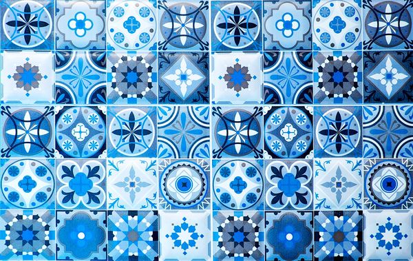 Blue and white patterned ceramic tiles arranged in a grid.