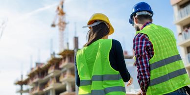 Safety coordinators looking at blueprints