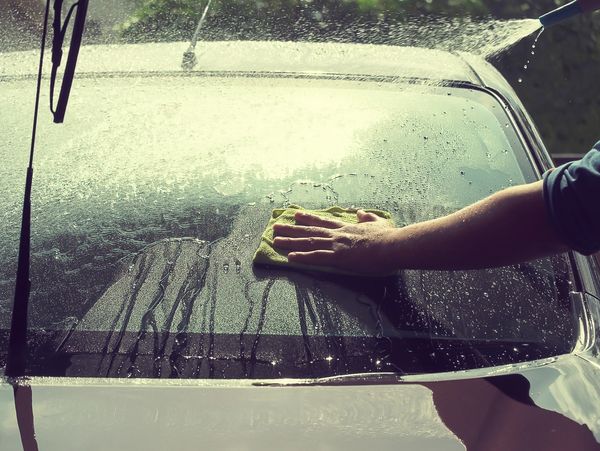 Pressure washing a car wheel