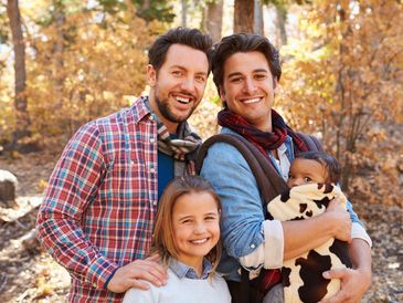 Happy, healthy family enjoying the outdoors in Autumn.