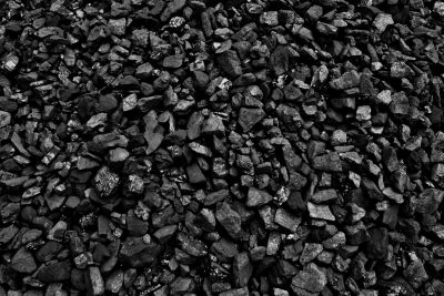 A close-up view of a pile of black coal chunks.