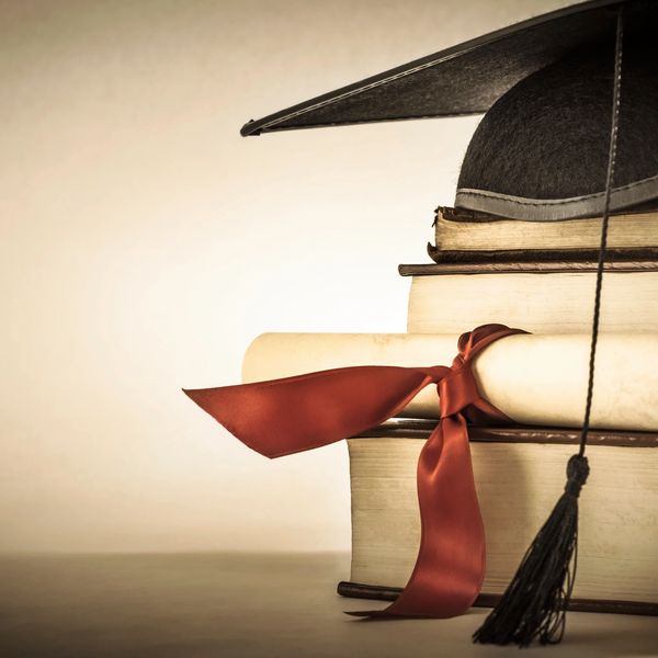 books, diploma, and graduation cap