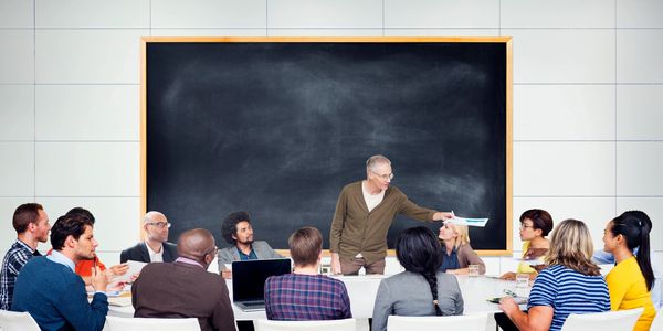 Image of a classroom and instructor.