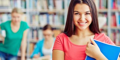 Teenage student in a library.