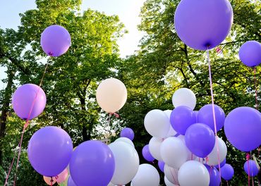 purple and white floating balloon decoration