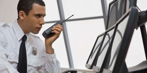 a security guard watching the monitors