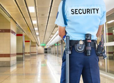 a security guard monitoring a hallway