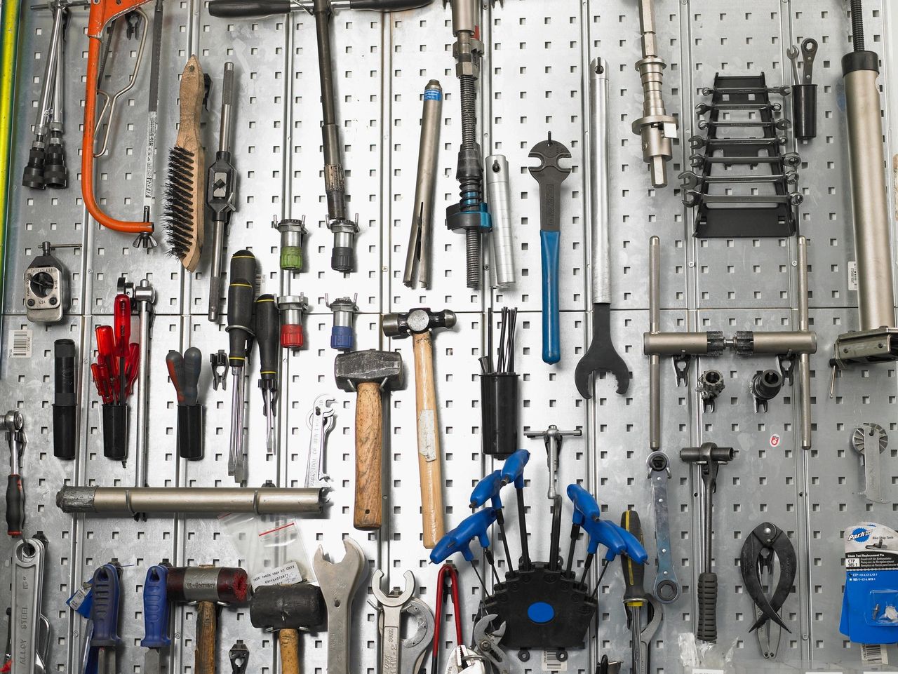 A wall of tools hand in the places ready for use.