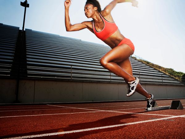 woman sprinting on the track