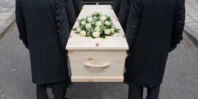 Pallbearers carrying coffin