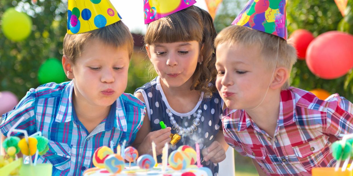 Birthday parties; children blow in the cake lights
