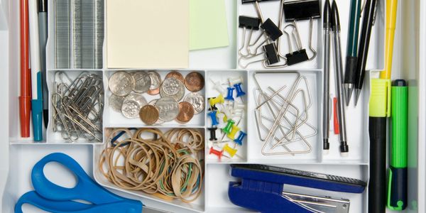 Easy to find office supplies on a tray.