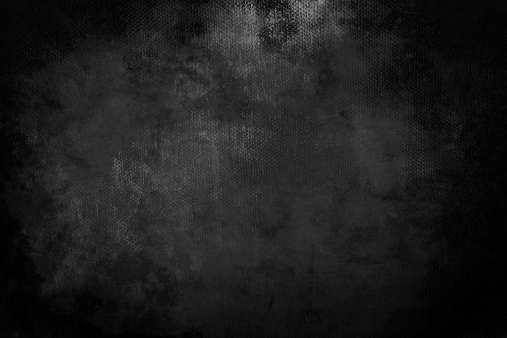 Textured black grunge background with subtle patterns and shading.