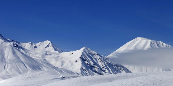 Gennady Podolsky - Bright blue skies and white snow covered mountains.