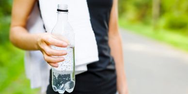 closeup shot of a water bottle in hand
