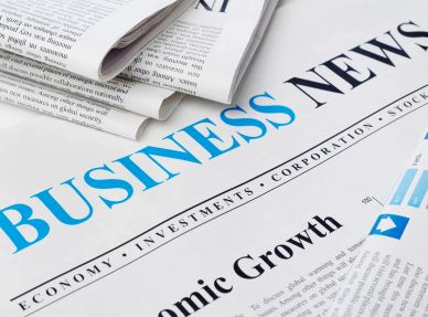 Close-up of a Business News newspaper.