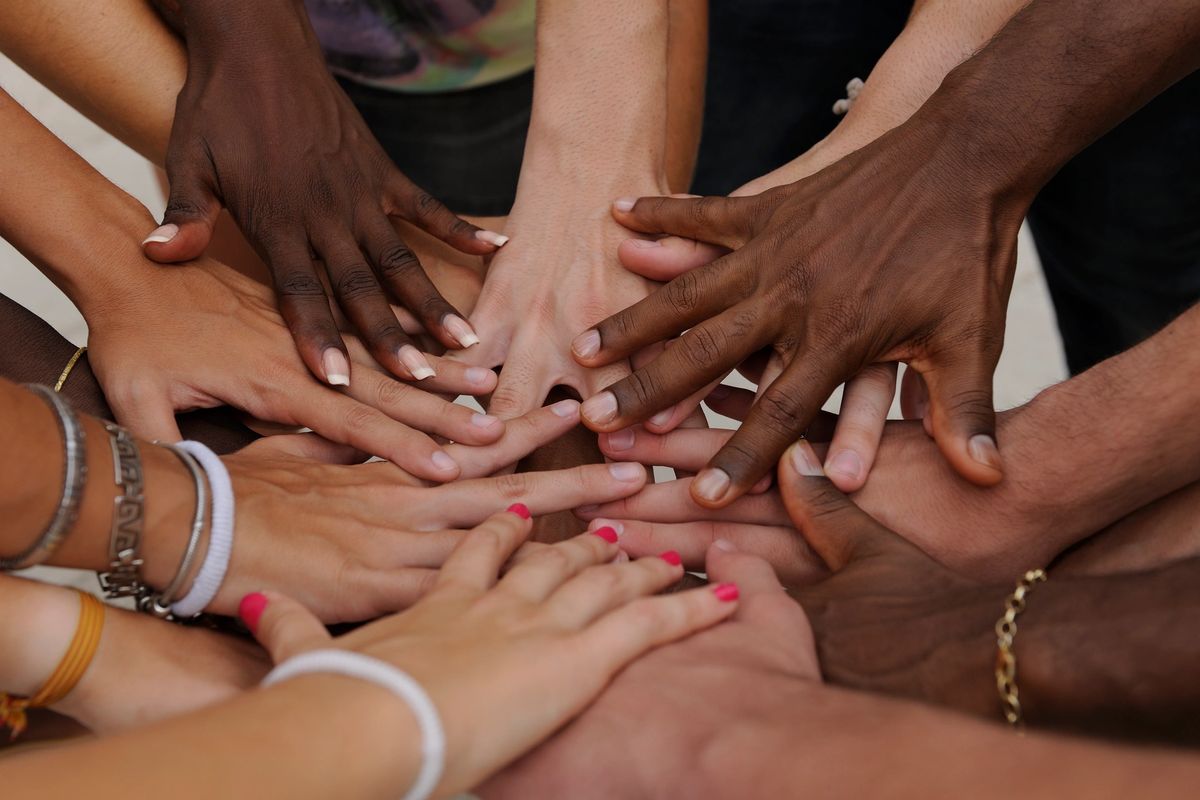 Hands joined together in community and connection