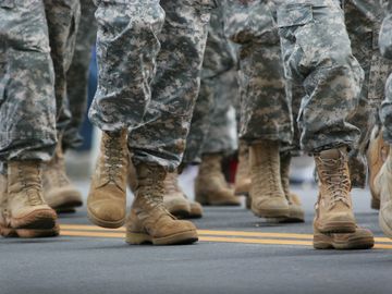 image of boots and legs of a group of military members