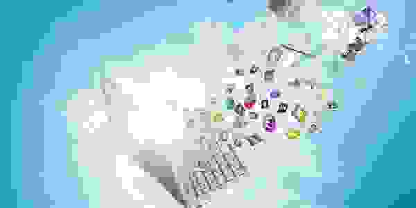 A computer with icons coming out of it on a blue background.