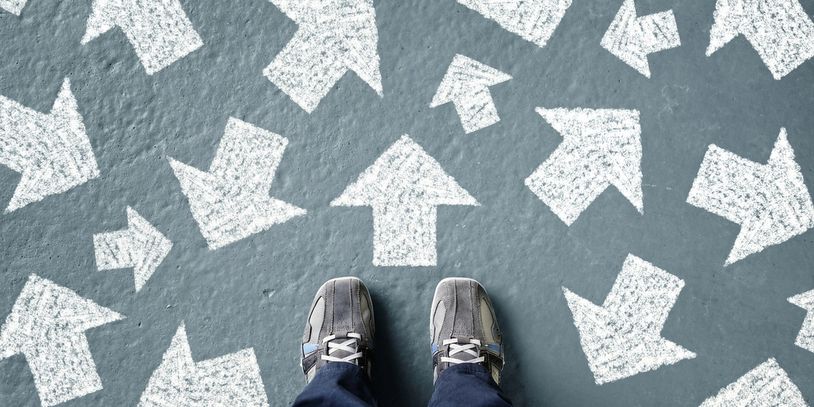 Adolescent or Teen standing at a floor with arrows pointing all different directions; needs guidance 