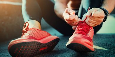 a guy tying his shoelaces