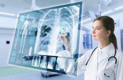 Doctor looking at an x-ray image on a screen, results, telemedicine