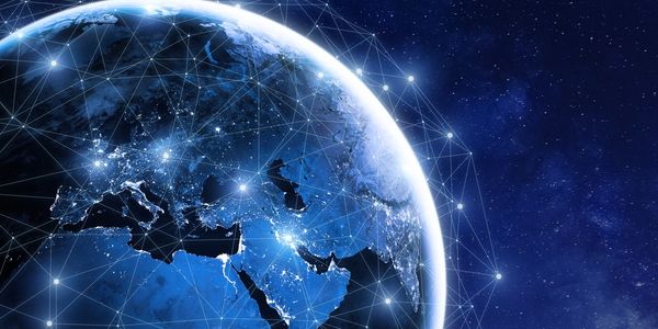 Digital network connections spanning the Earth at night.