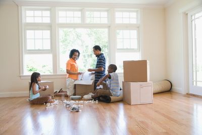 Family packing up and moving from their home to their new house