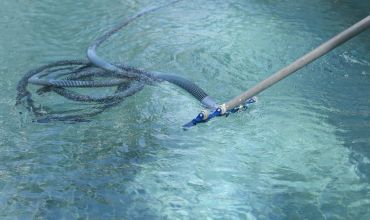 A net skimming the surface of clear water.